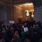 Massing against Gov. Gregoire in her Office. Olympia, WA. 11/28/2011. Photo by William Bass.