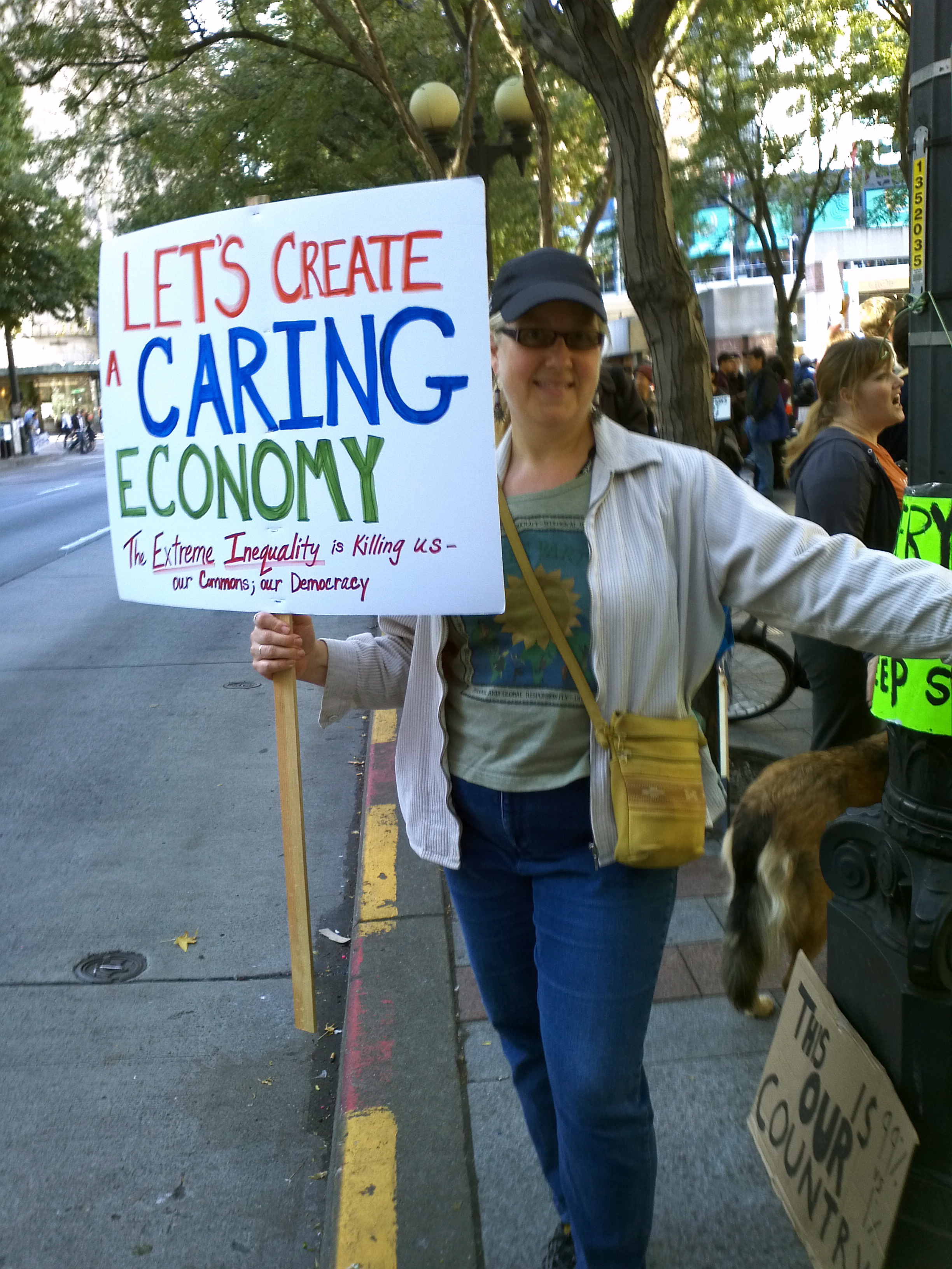 William's friend, activist Syd Fredrickson demonstrating for "a Caring Economy" during the Occupy Seattle! Rally & March on Saturday 8 October 2011. Foto by William Bass.